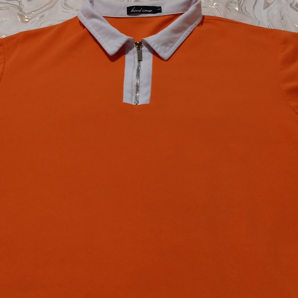 Excellent condition..short sleeve, partial zip front shirt